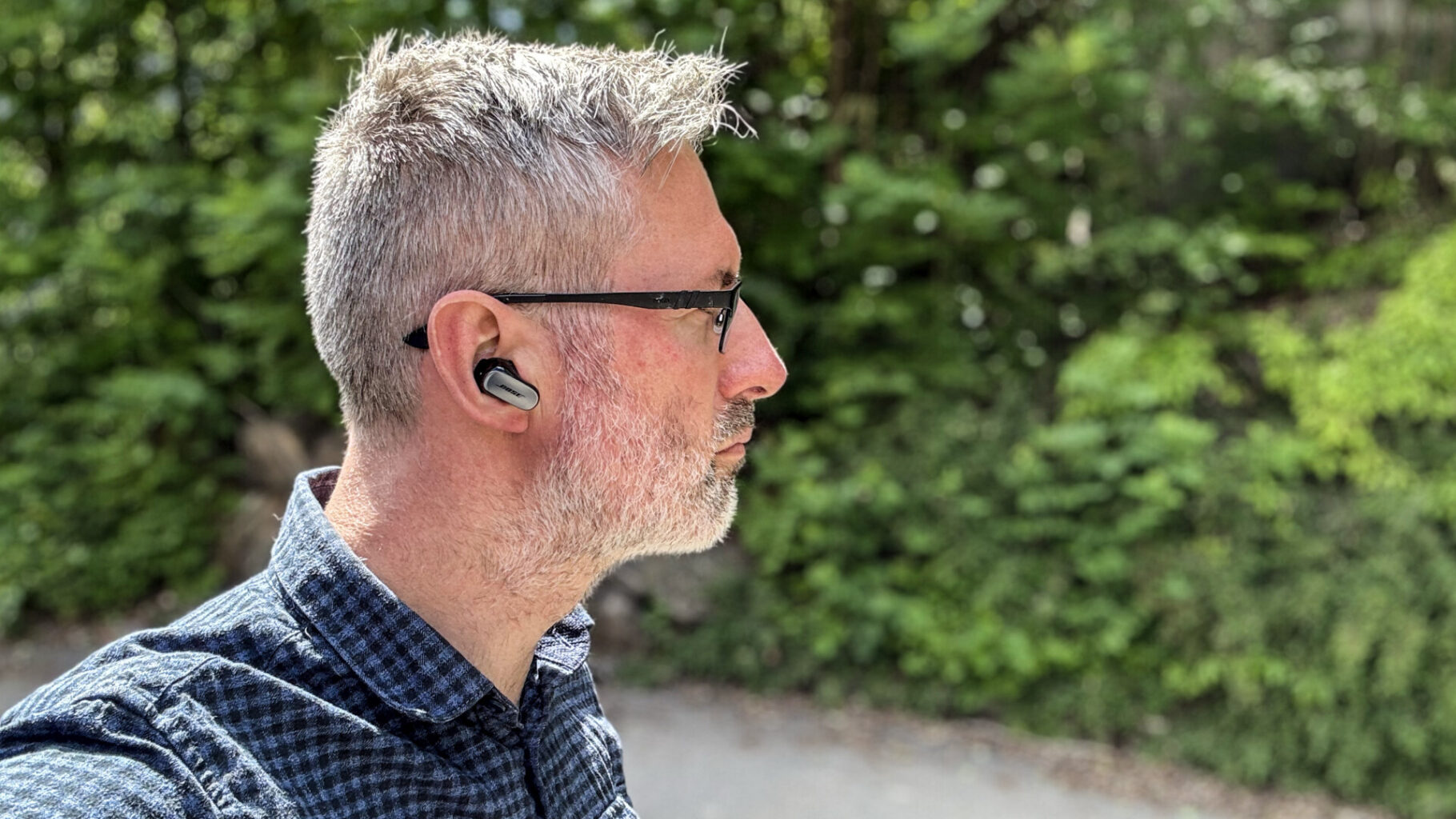 Bose QuietComfort Ultra Earbuds 1 a man wearing glasses and a bluetooth earbud Bose QuietComfort Ultra Earbuds - GeirNordby