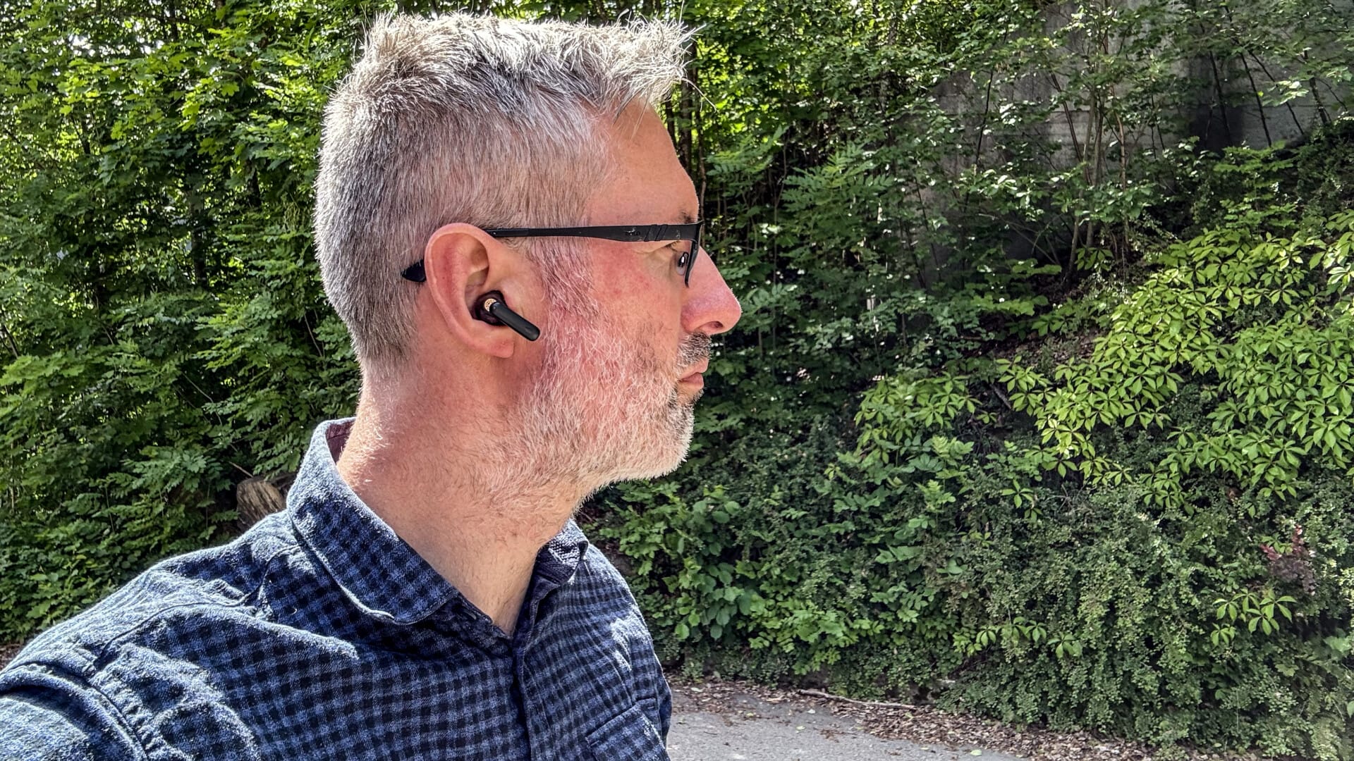 Creative Aurvana Ace 2 1 a man wearing a bluetooth earbud Creative Aurvana Ace 2 - GeirNordby